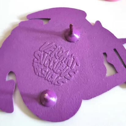 Verdant Succubus logo emboss on enamel pin